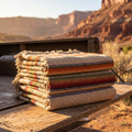 Tan serape camp blanket folded on pickup truck tailgate